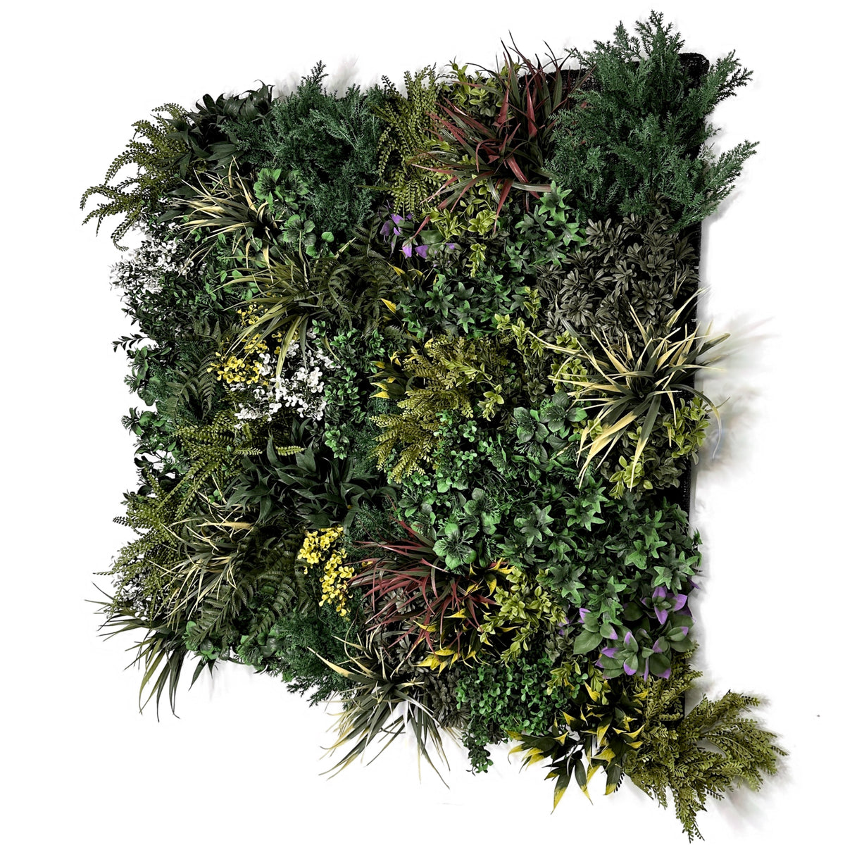 Artificial foliage wall panel with dark green branches, yellow accents, purple flowers, white specks