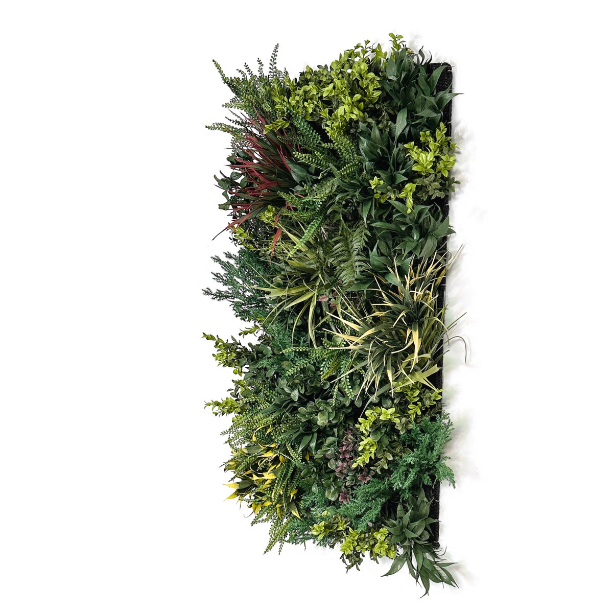 Artificial foliage wall panel with mixed green leaves, ferns, and small sprouts