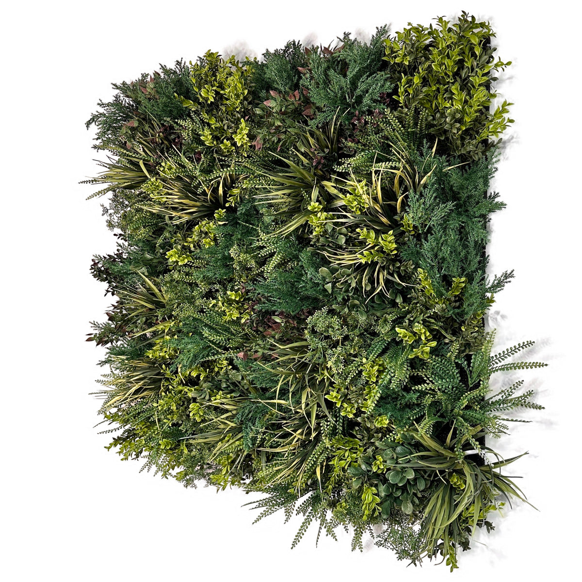 Artificial green foliage wall panel with layered leaves, fern-like fronds, and needle tips
