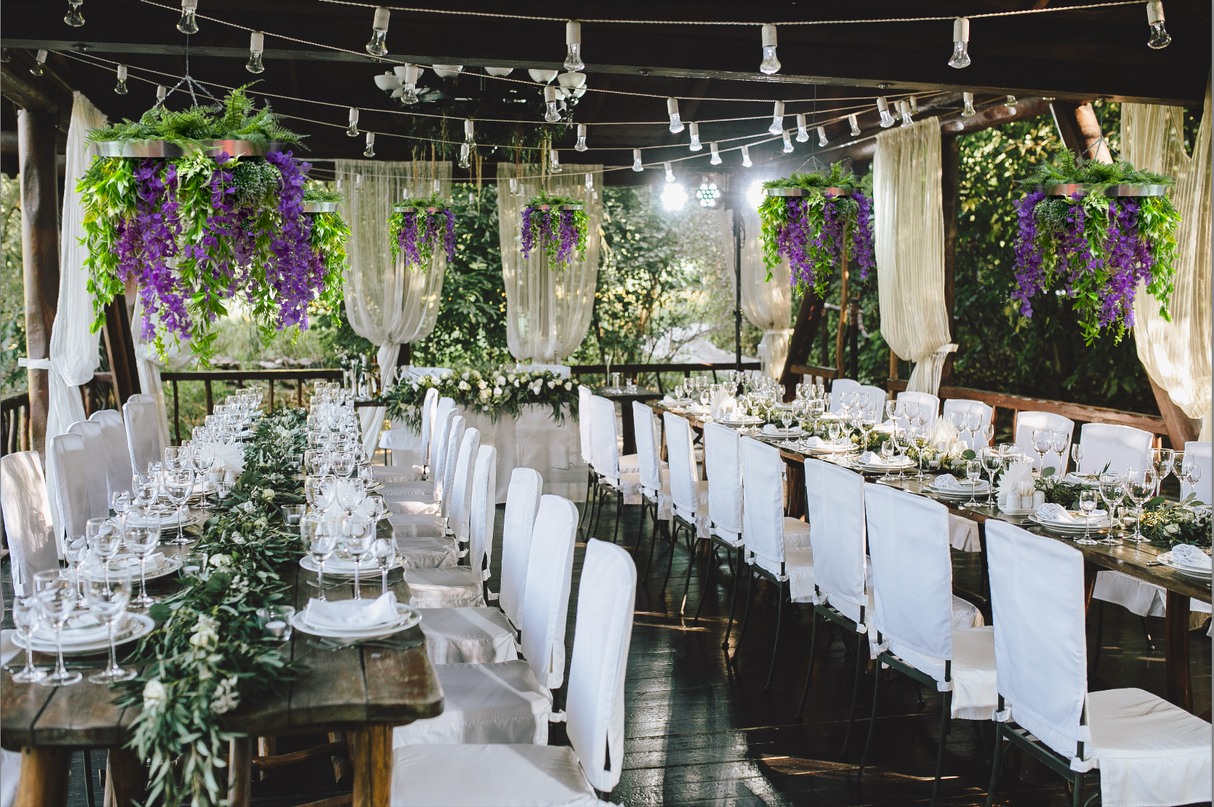 Hanging hoop with a mixture of artificial green plants with purple trailing flowers 60cm diameter