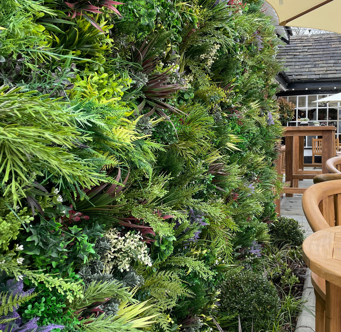 Artificial green wall in a pub garden