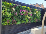 Artificial green wall panel with variegated foliage ivy palms grasses and ferns