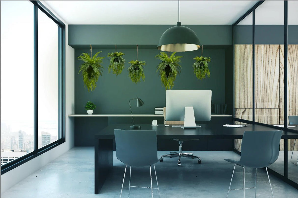 Artificial trailing fern kokedama with small hanging green fern fronds from twine