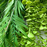 Artificial green waterfall wall with ferns