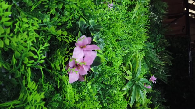 Artificial green wall panel with  ferns palms and pink flowers 100x100 cm