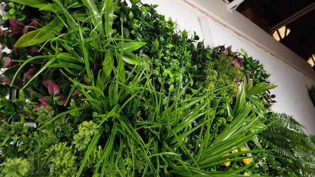 Artificial green wall panel with variegated mixed greens, red , white and yellow flowers  100x100 cm