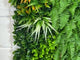 Artificial green wall panel with mixed green orange red and white foliage, white and yellow flowers 100x100 cm