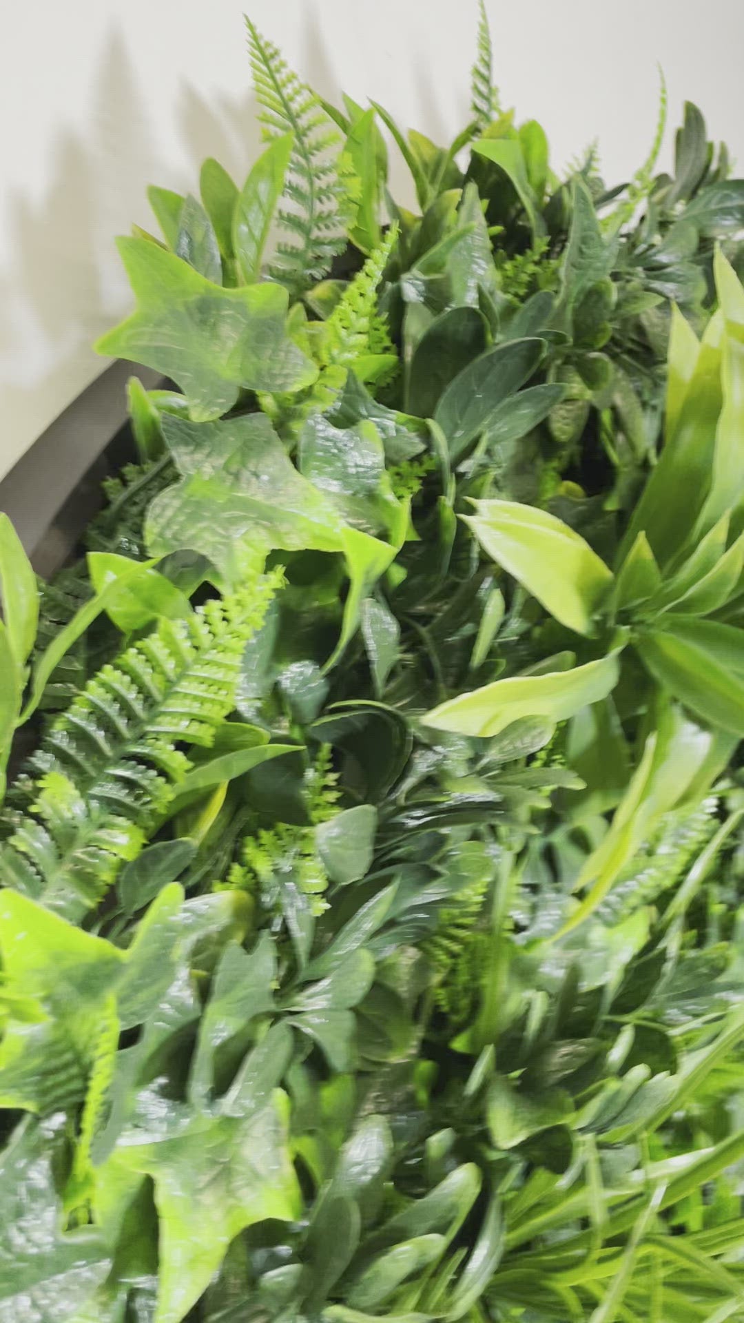 Load video: Artificial green foliage wall circulare art panel black aluminium - 2 x 50cm