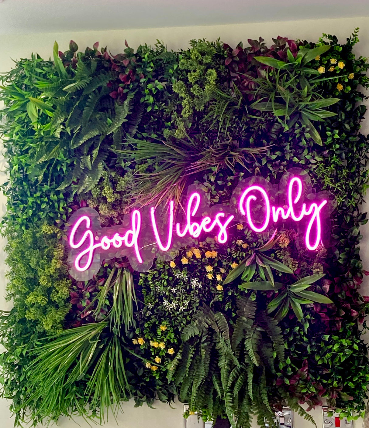 Artificial green wall panel with variegated mixed greens, red , white and yellow flowers  100x100 cm