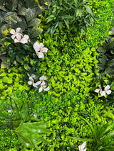 Artificial green wall panel with variegated green foliage  palms grasses eucalyptus and white flowers 100x100 cm