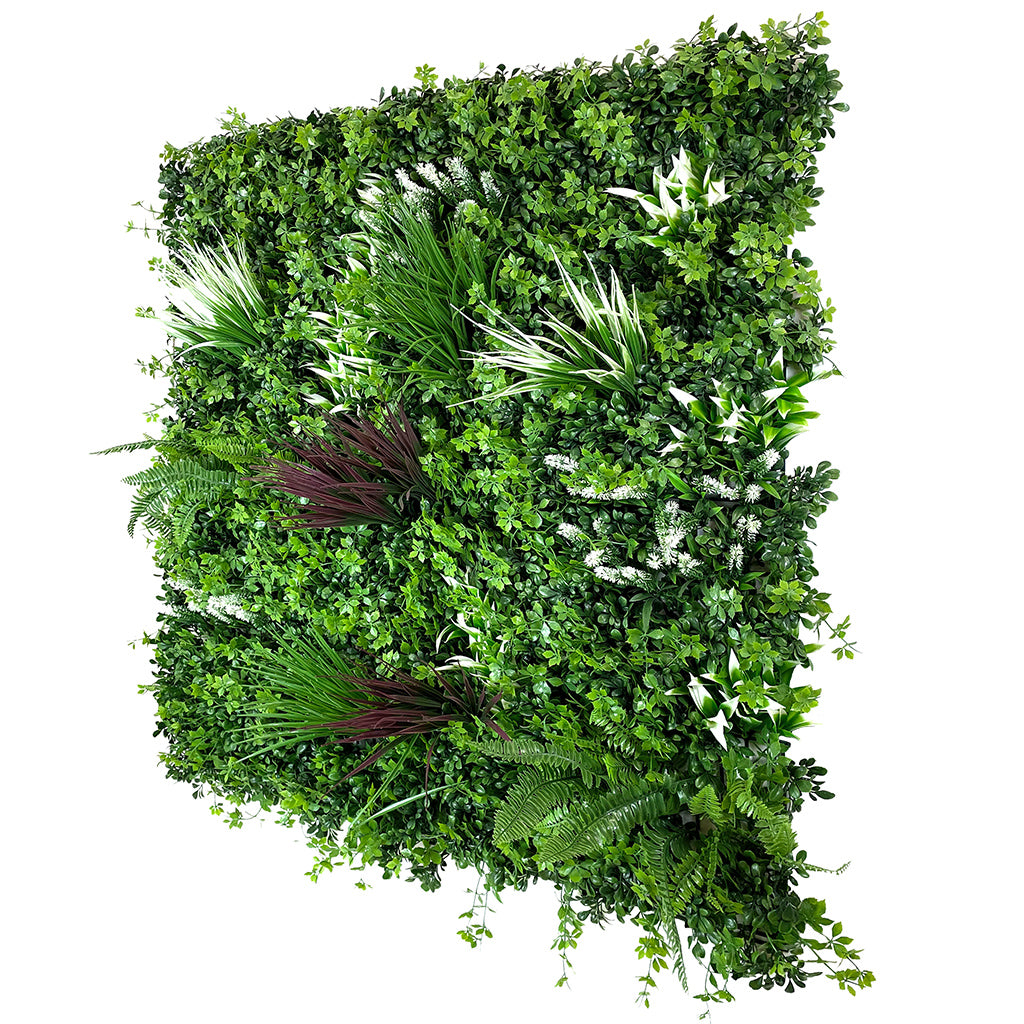 Artificial green wall panel with thick mixed foliage, palm fronds, and light green accents
