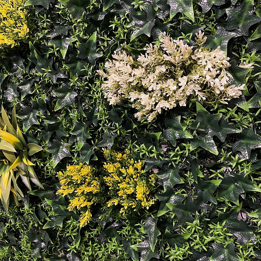 Artificial green wall panel with variegated green, red,  white & yellow foliage with ferns, palm heads, grasses & white flowers  100x100 cm