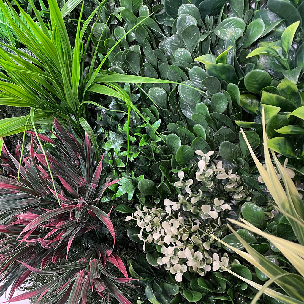 Artificial green wall panel with variegated green red foliage, yellow grasses ferns and eucalyptus  100x100 cm