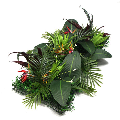 Artificial plant wall arrangement with green foliage and red-yellow bird-of-paradise accents