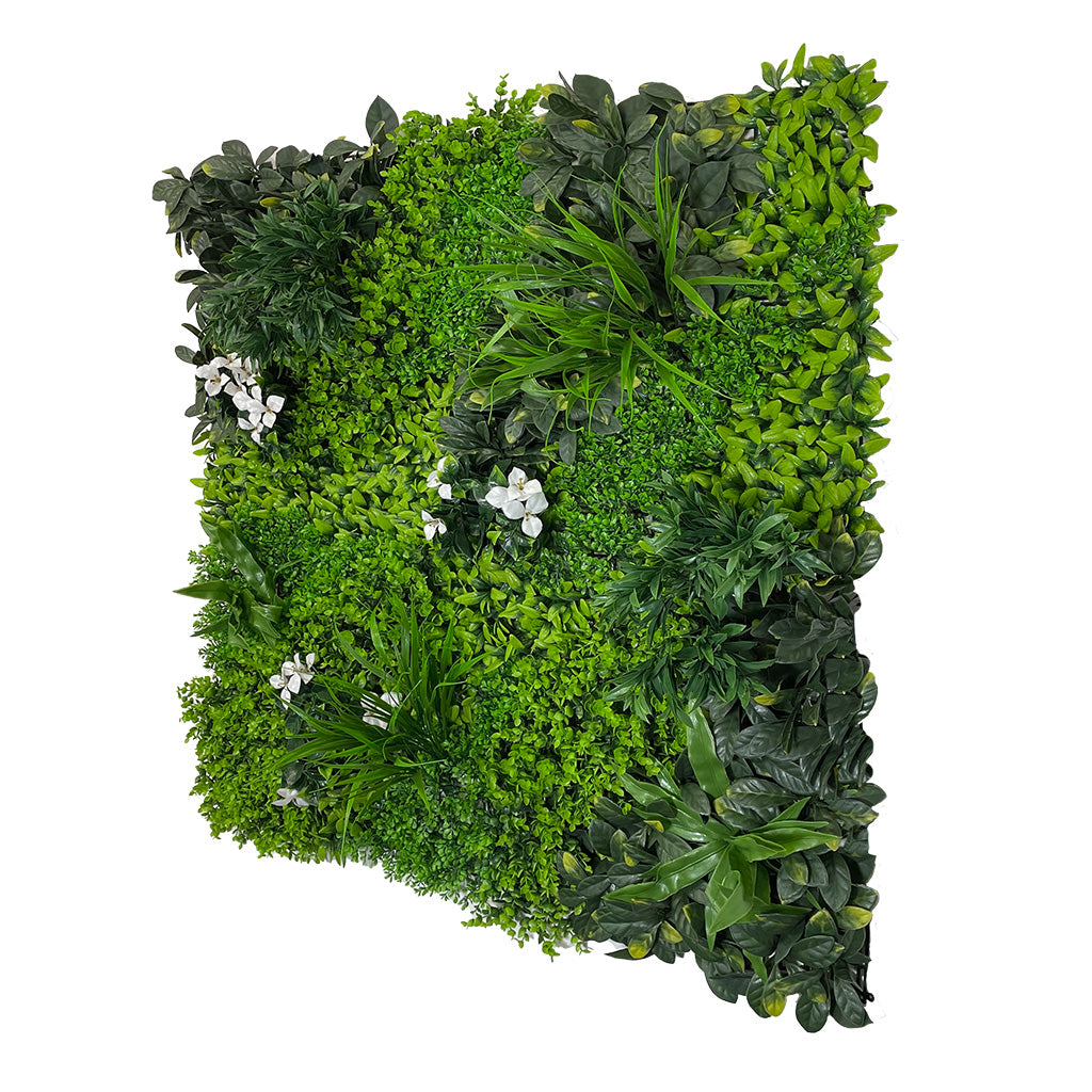 Artificial green wall panel with variegated green foliage  palms grasses eucalyptus and white flowers 100x100 cm