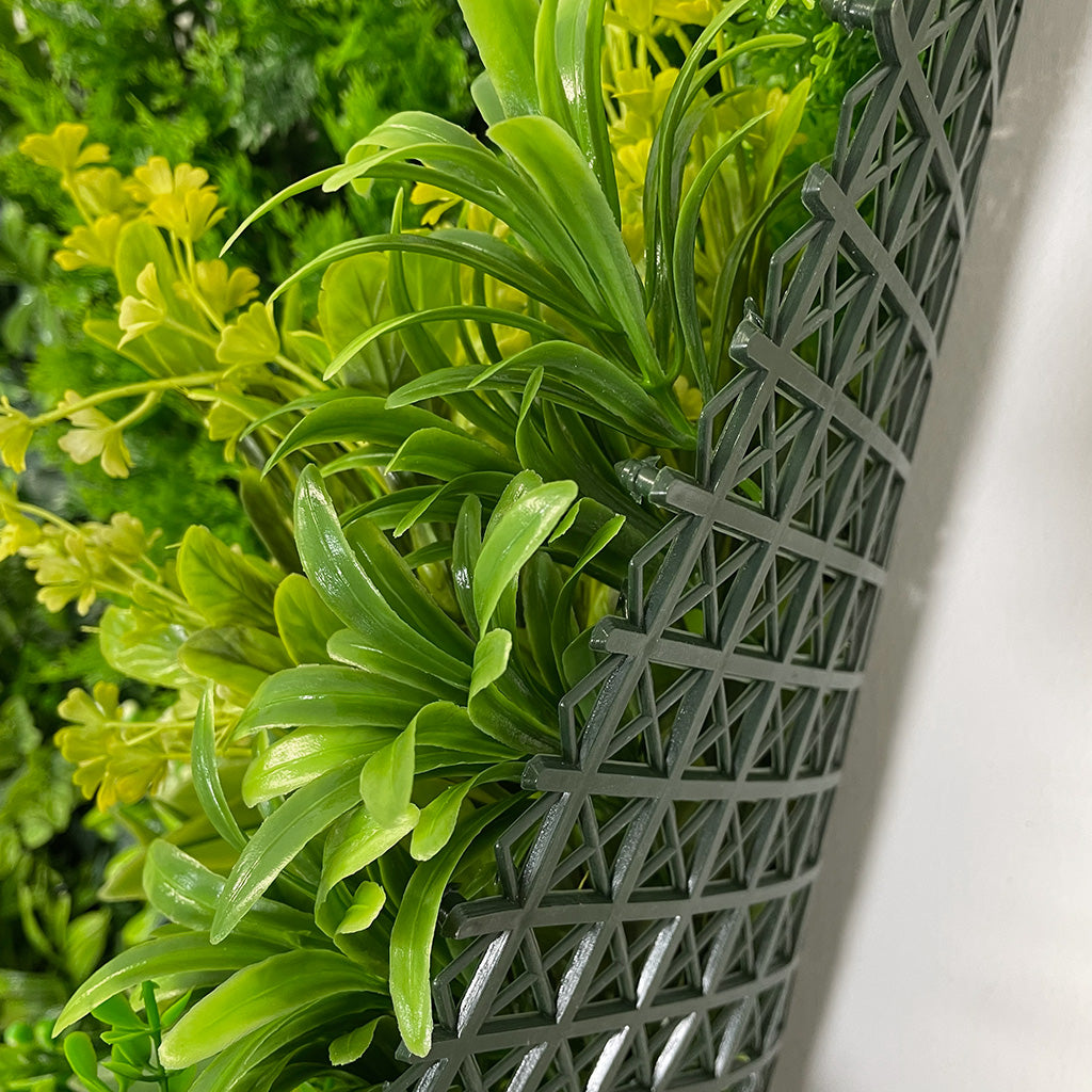 Artificial green wall panel varigated  green foliage  palms heads white flowers and orange flowering heads   100x100 cm