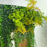 Hanging hoop with a mixture of artificial green plants with yellow flowers 80cm diameter
