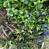 Artificial 3D plant wall with lush green, purple, red and white foliage 100x50cm