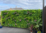 Artificial green wall panel with  ferns palms and pink flowers 100x100 cm