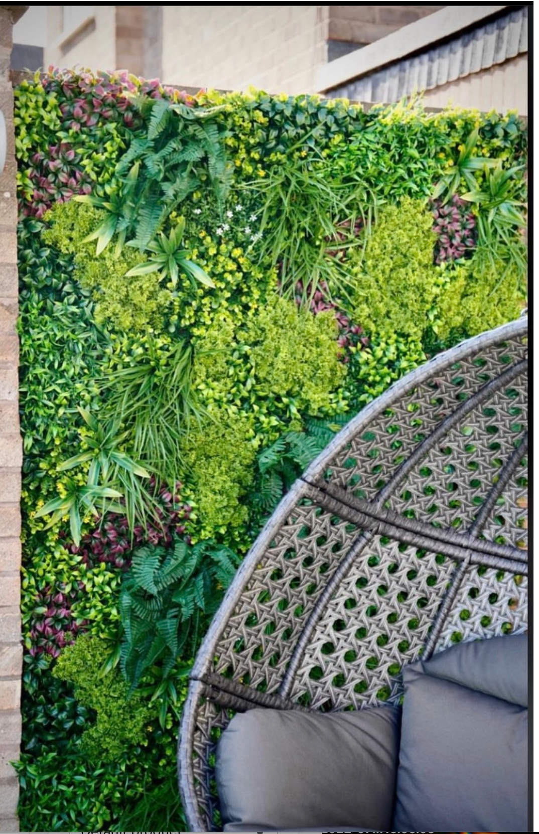 Artificial green wall panel with variegated mixed greens, palms, grasses, reds, white and yellow flowers  100x100 cm