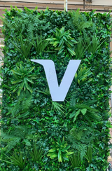 Artificial green wall panel with variegated foliage ivy palms grasses and ferns 100x100 cm