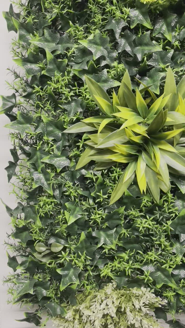 Artificial green wall panel with variegated green, red,  white & yellow foliage with ferns, palm heads, grasses & white flowers  100x100 cm