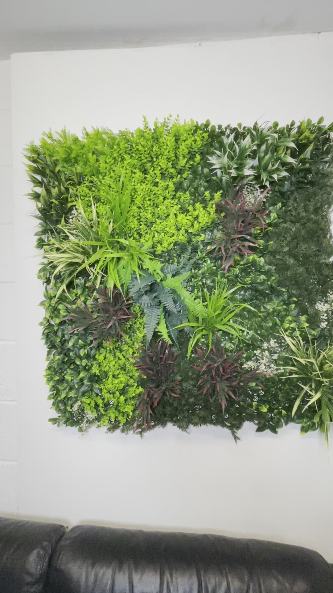 Artificial green wall panel with variegated green red foliage, yellow grasses ferns and eucalyptus  100x100 cm