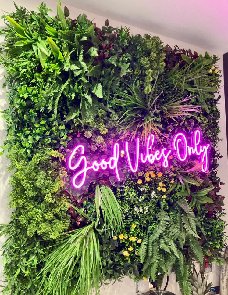 Artificial green wall panel with variegated mixed greens, red , white and yellow flowers  100x100 cm