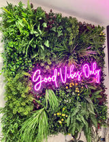 Artificial green wall panel with variegated mixed greens, red , white and yellow flowers  100x100 cm