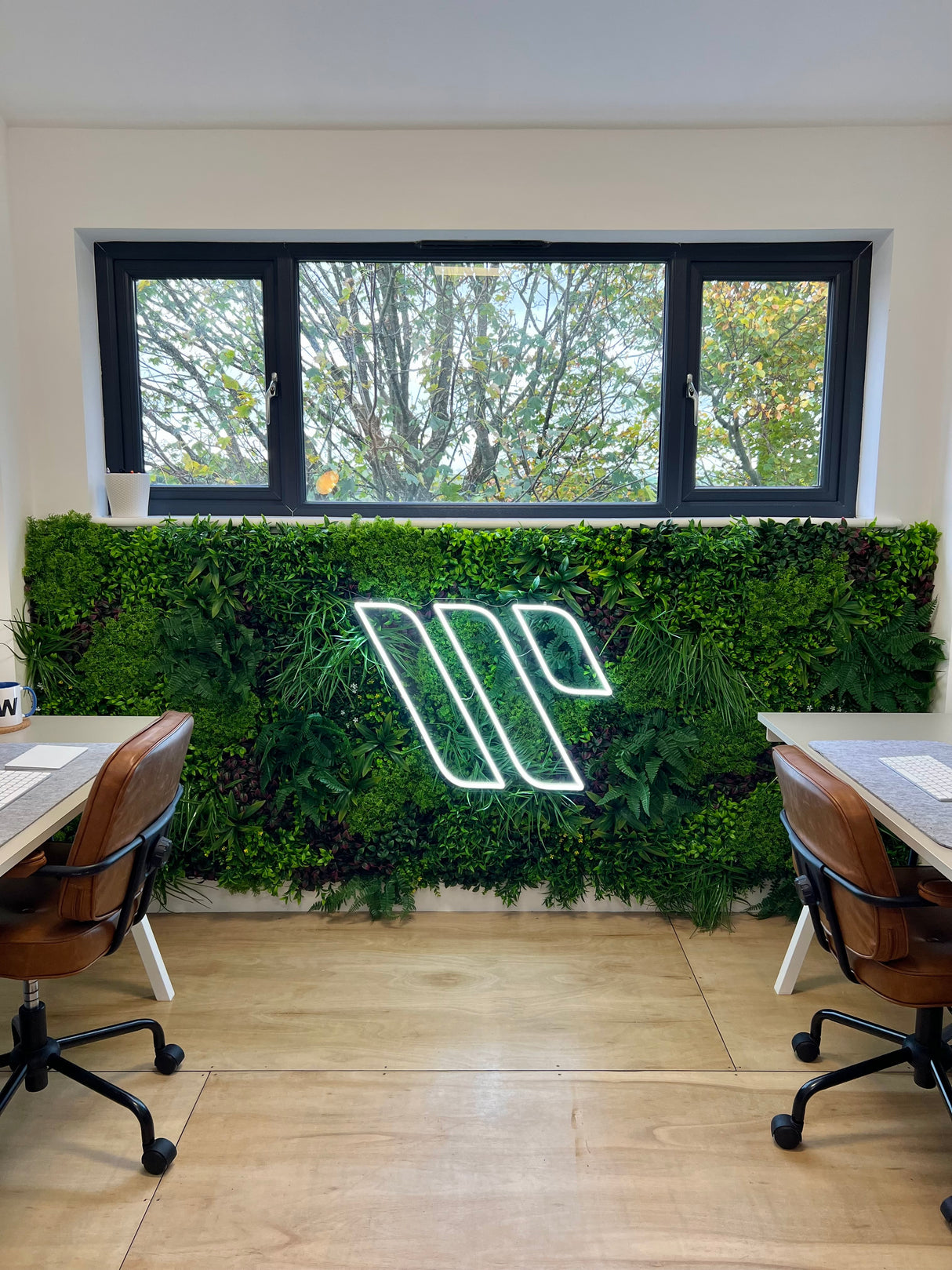 Artificial green wall panel with variegated mixed greens, palms, grasses, reds, white and yellow flowers  100x100 cm