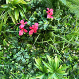 Artificial green wall panel with variegated foliage ivy palms grasses and ferns with cerise flowers 100x100 cm
