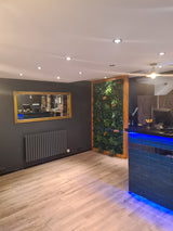 Artificial green wall panel with variegated foliage ivy palms grasses and ferns with orange flowers 100x100 cm