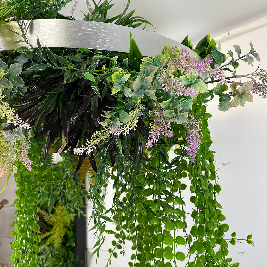 Hanging hoop with a mixture of artificial green plants with yellow flowers 40cm diameter