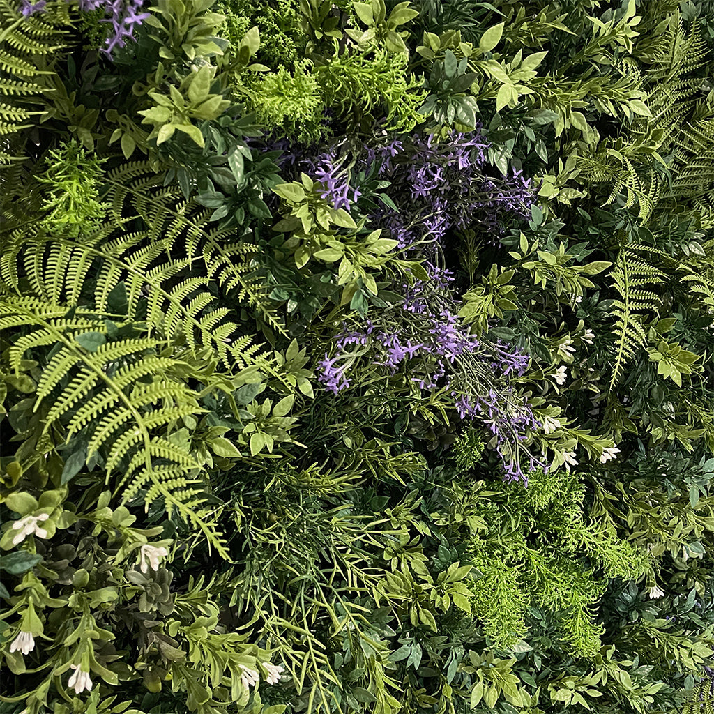 Artificial 3D plant wall with green foliage and small purple flowers - 100x100cm